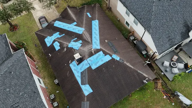 Overhead drone photo of a storm-damaged roof in Cypress, TX